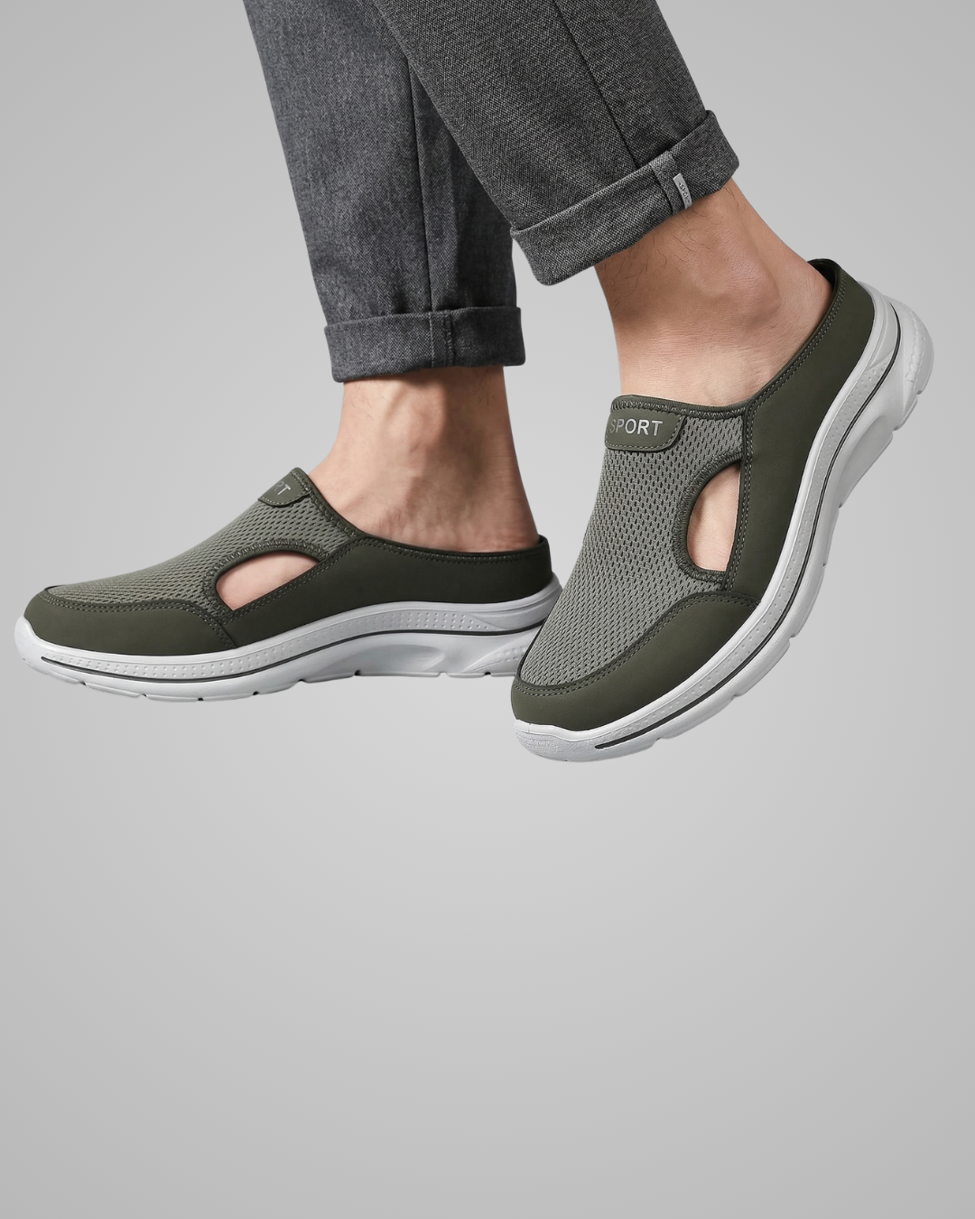 Person wearing green slip-on shoes with 'Joules' branding on a gray background