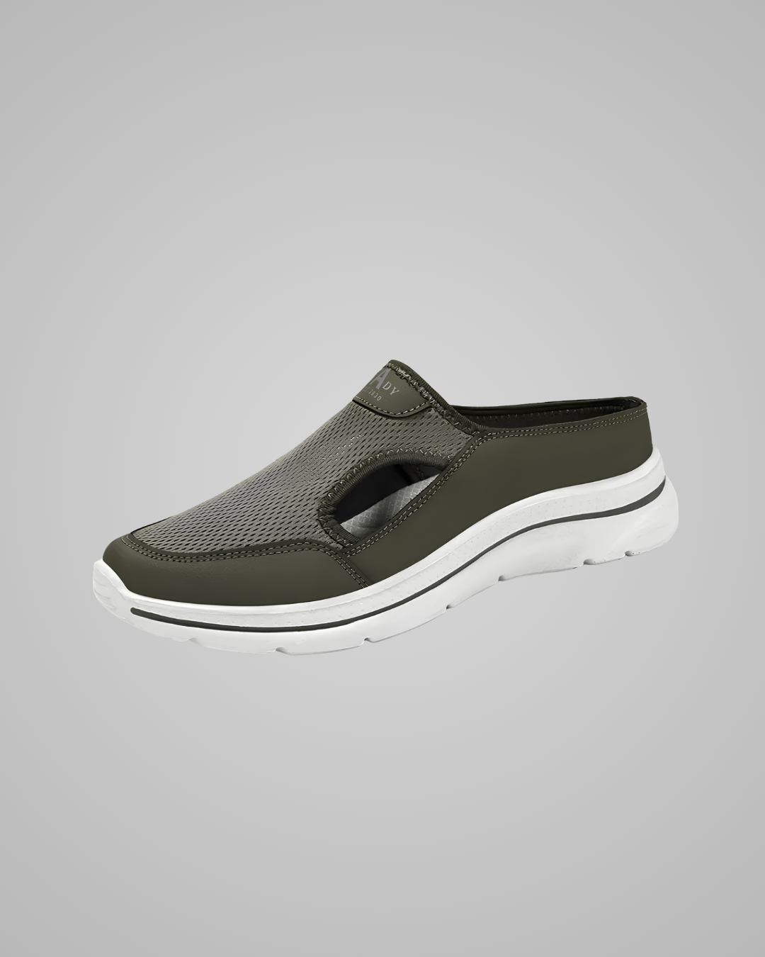 Green slip-on shoe with white sole on a gray background