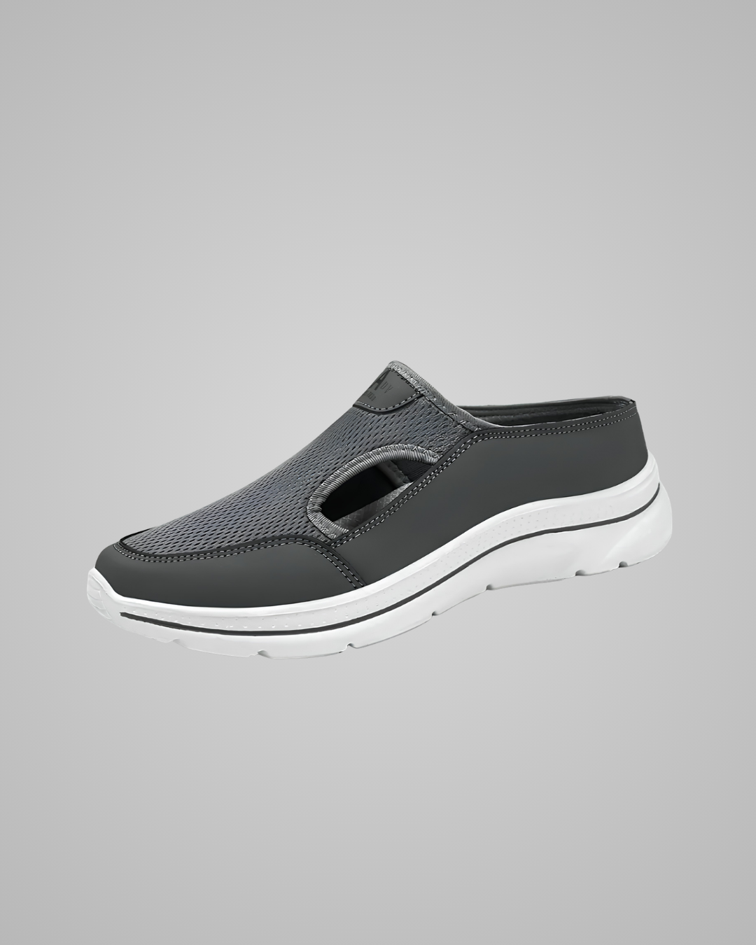 Gray slip-on shoe with white sole on a gray background