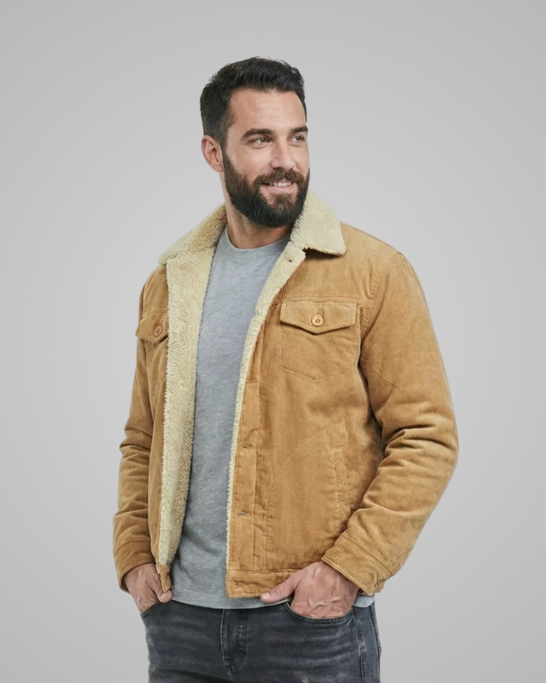 Man wearing a tan sherpa-lined jacket against a gray background