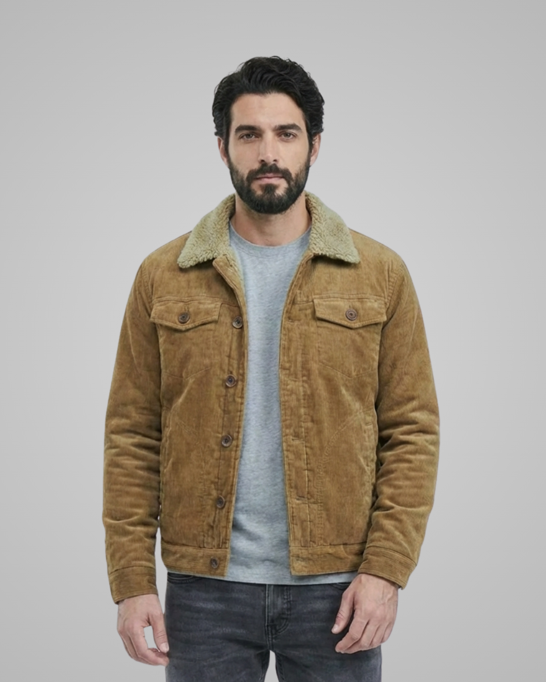 Man wearing a brown corduroy jacket with a gray background