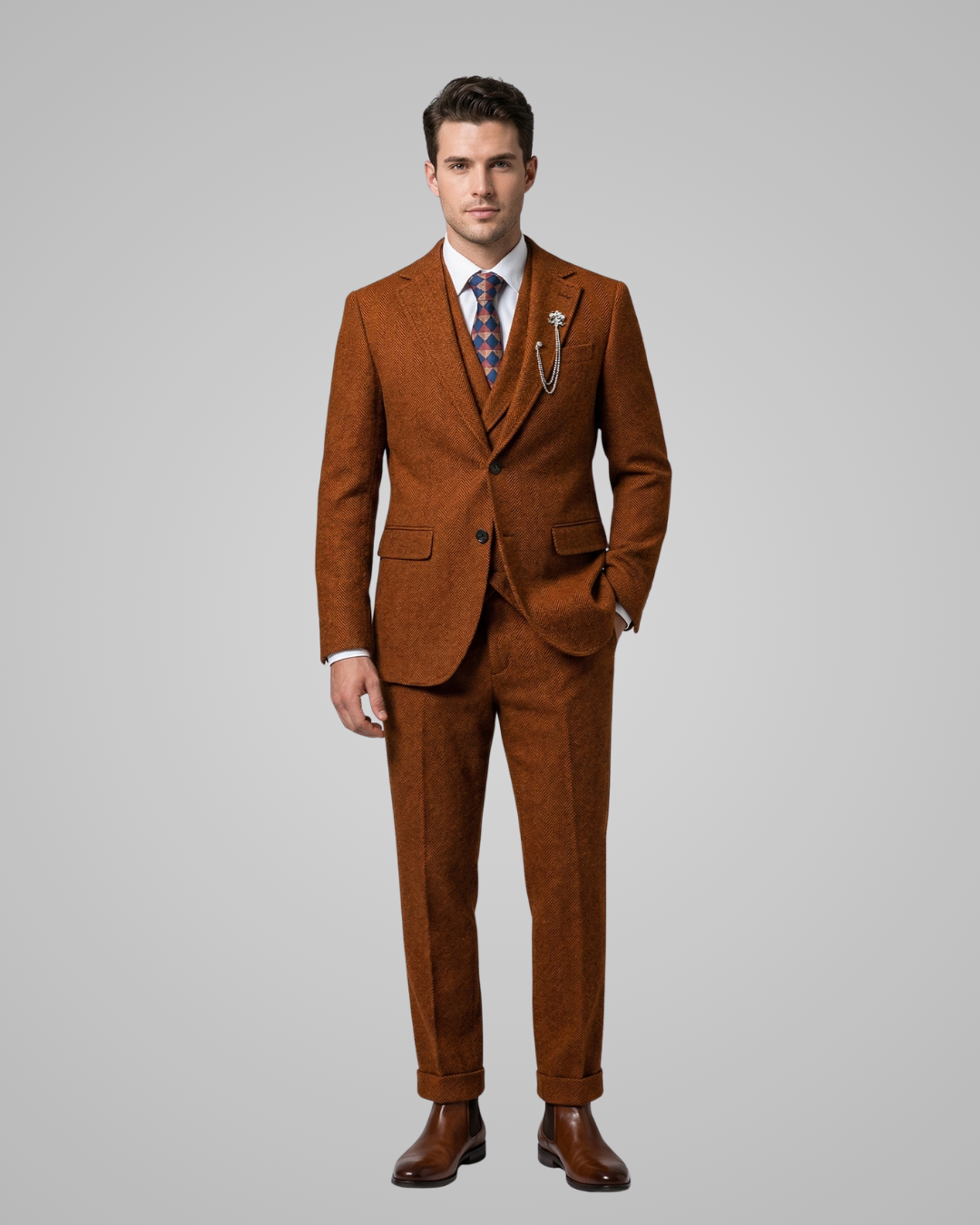 Man wearing a brown suit with a tie on a gray background