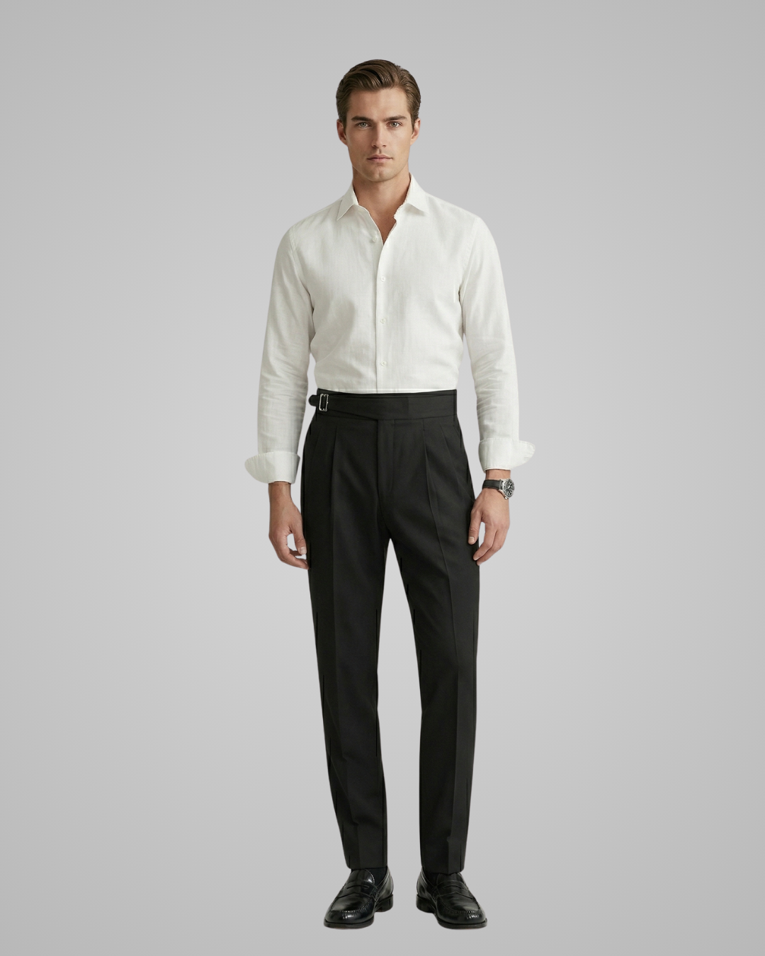 Man wearing a white dress shirt and black pants on a gray background