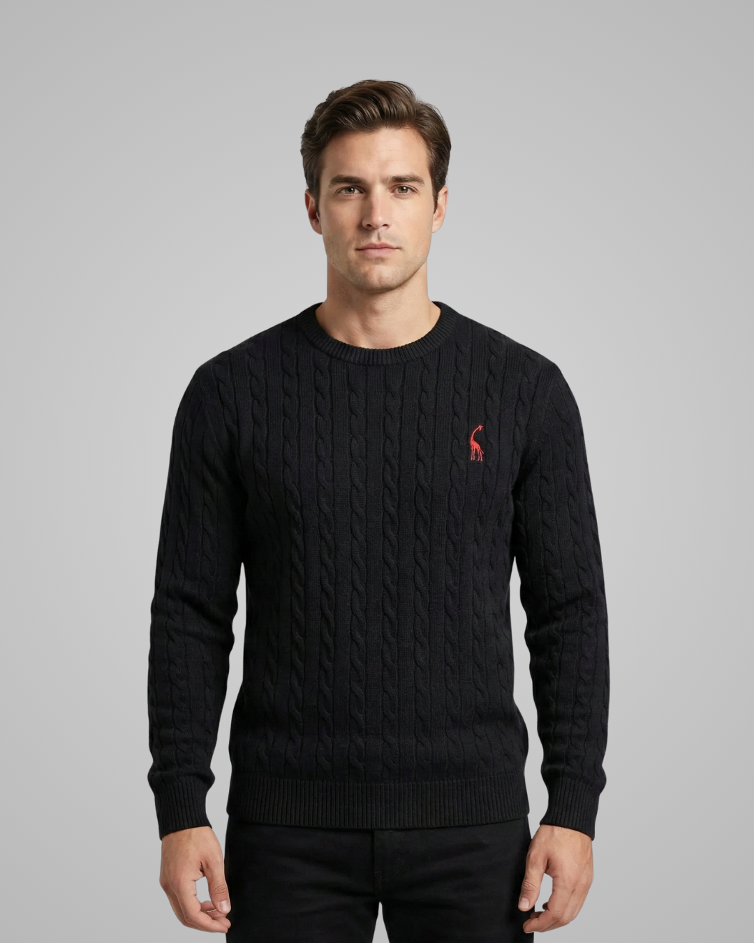 Man wearing a black sweater with a red logo on a gray background