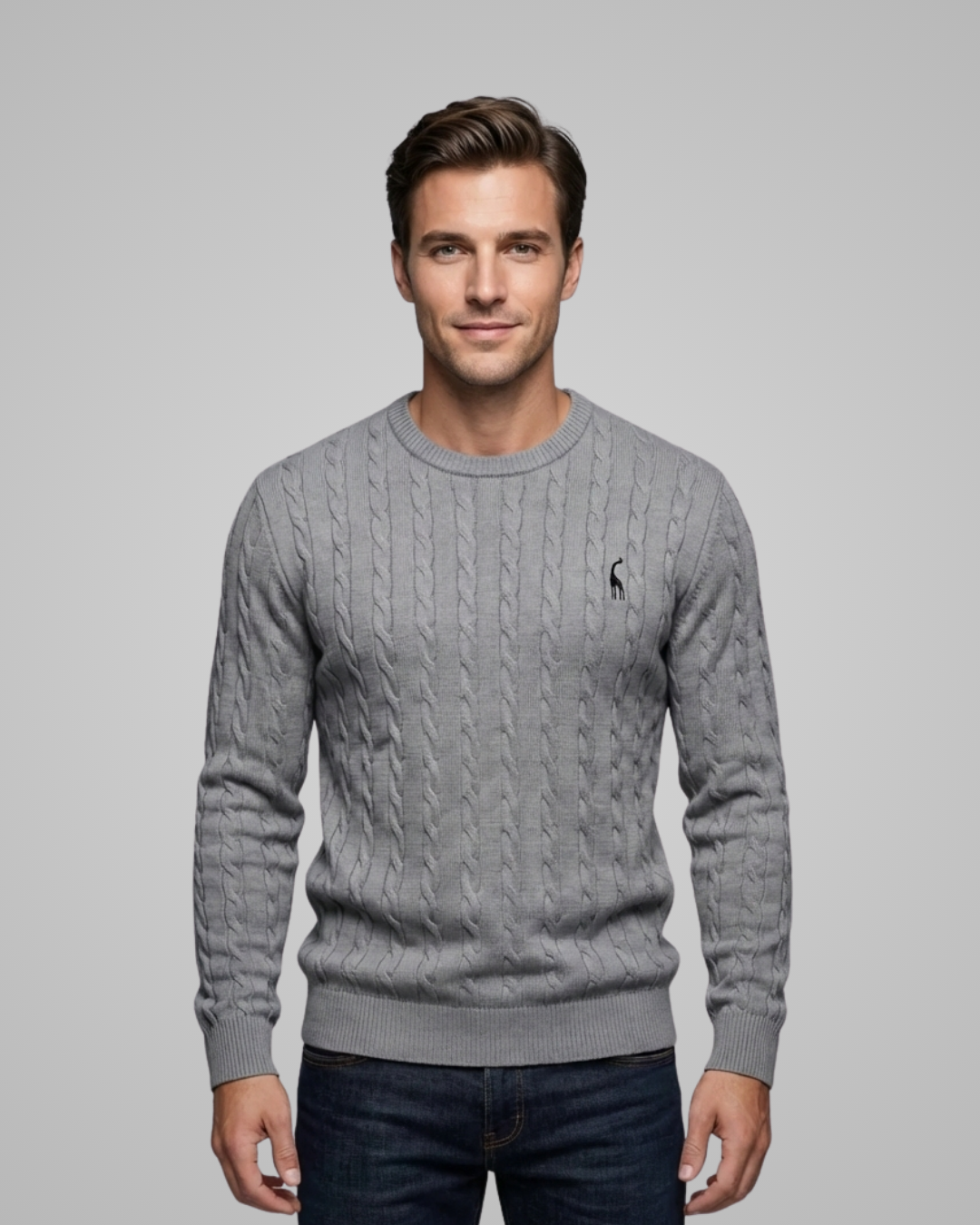 Man wearing a gray sweater with a logo on a gray background