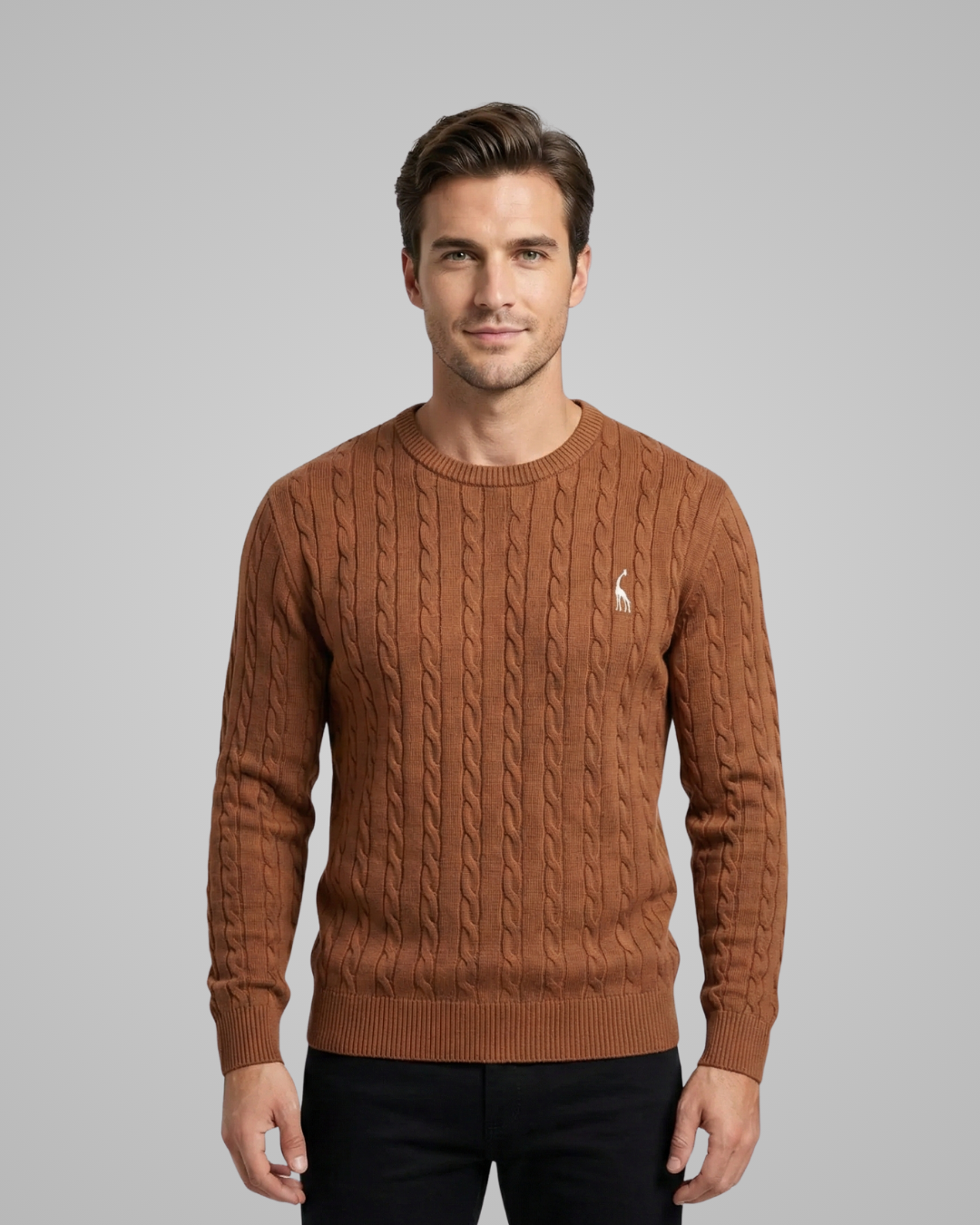 Man wearing a brown cable knit sweater with a logo on a gray background