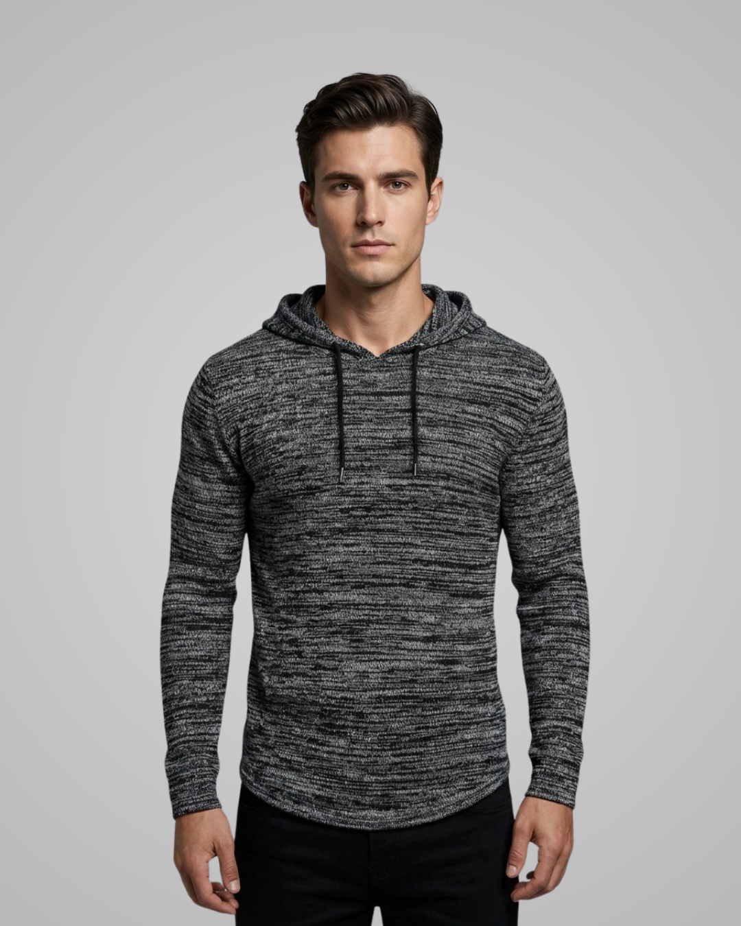 Man wearing a gray hoodie against a plain background