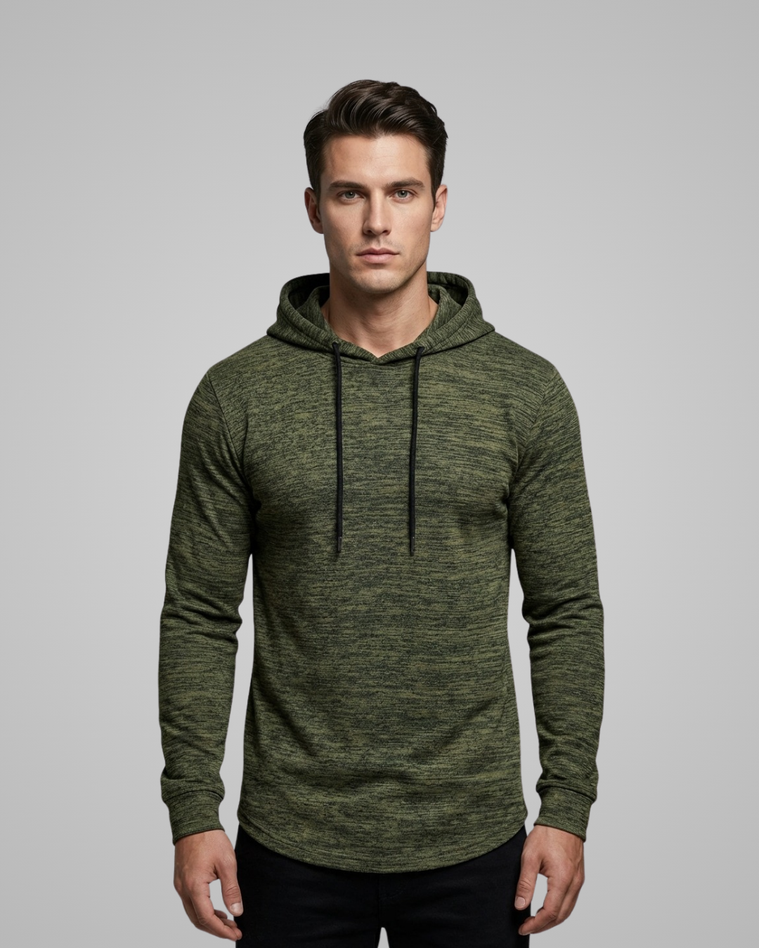 Man wearing a green hoodie against a gray background