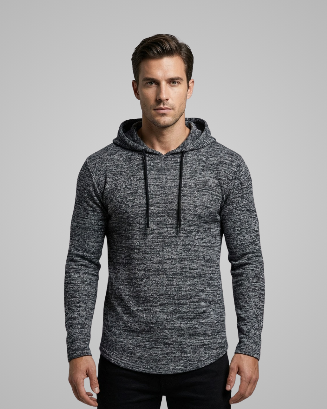 Man wearing a gray hoodie against a plain background