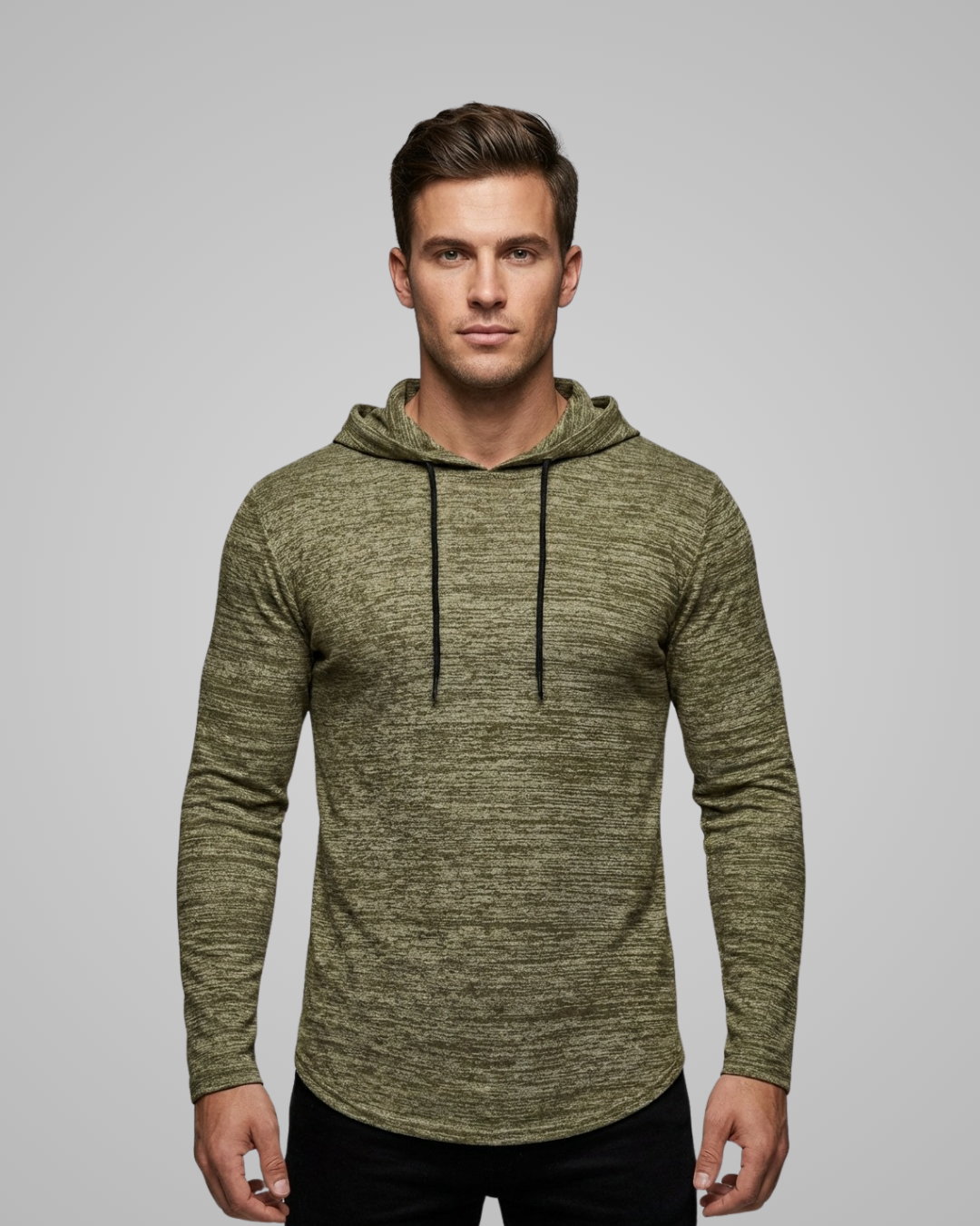 Man wearing a green hoodie against a gray background