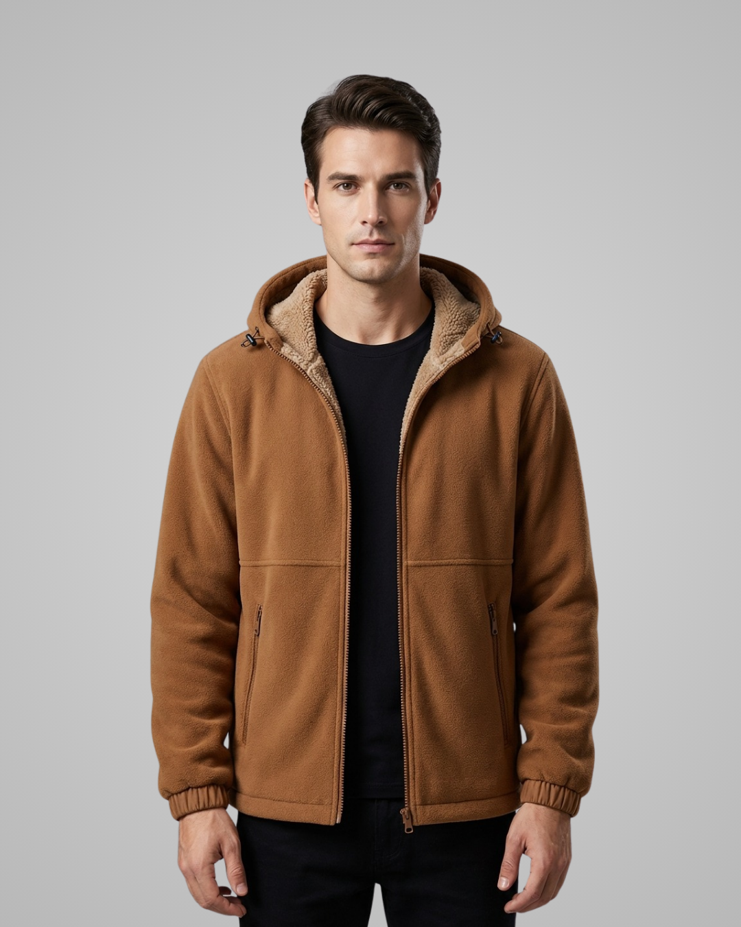 Man wearing a brown jacket with a fur-lined hood on a gray background