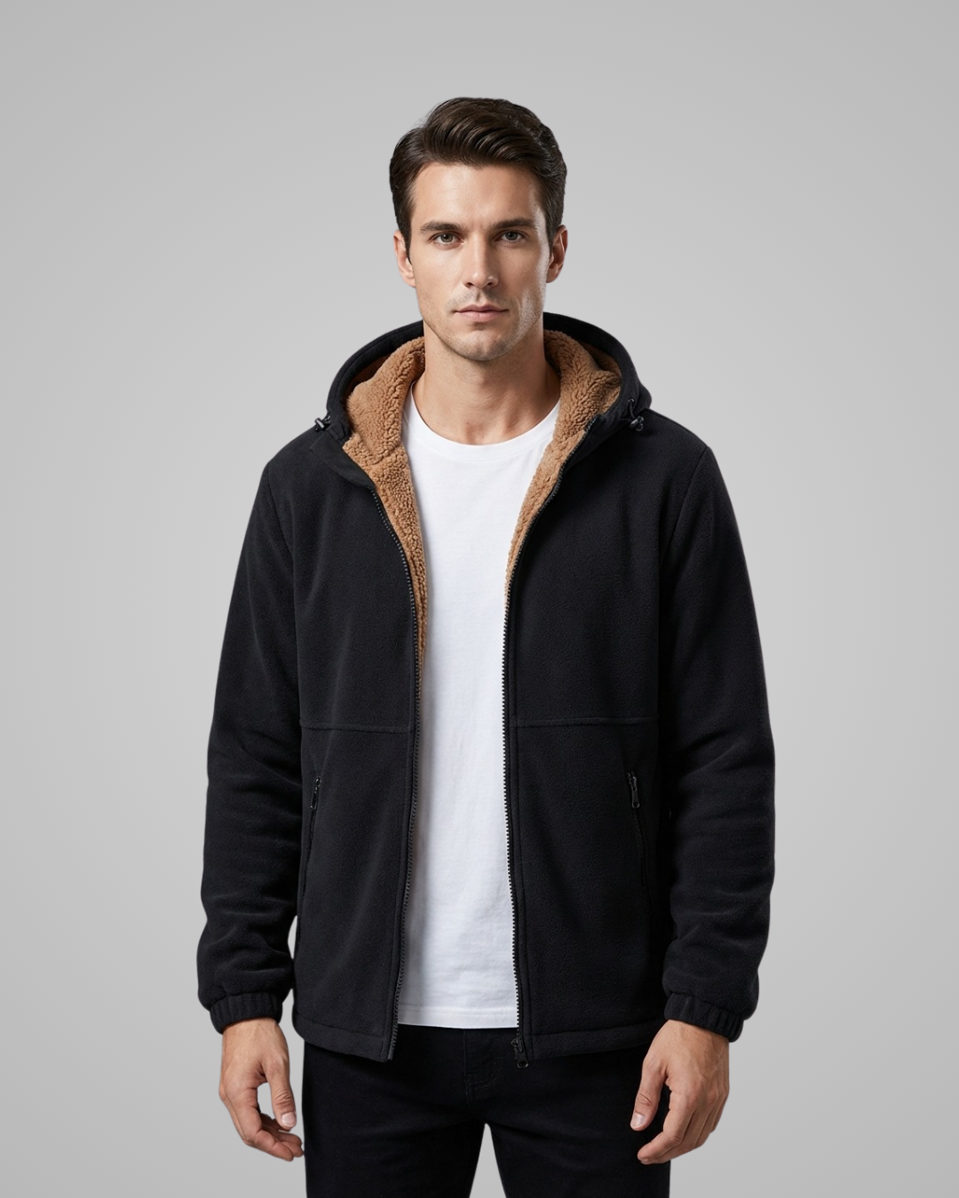 Man wearing a black jacket with brown lining on a gray background