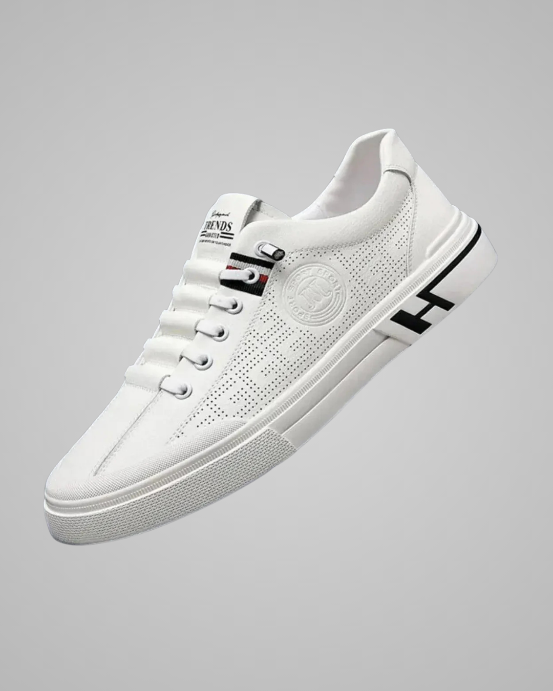 White sneaker with brand logo on a gray background
