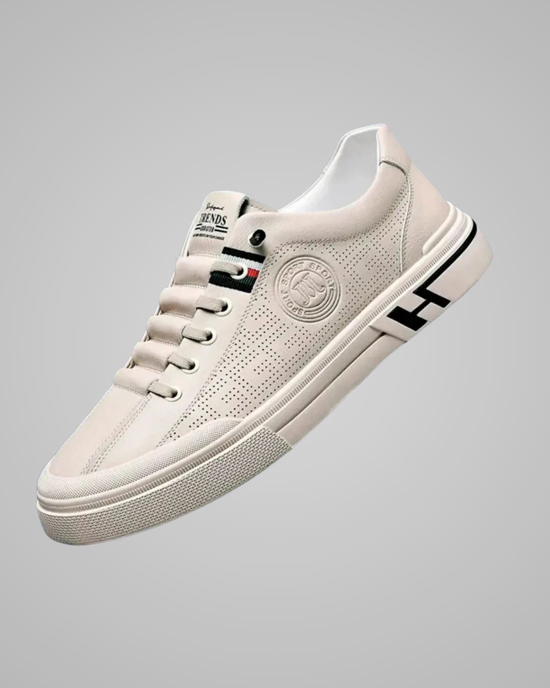 White sneaker with black accents on a gray background