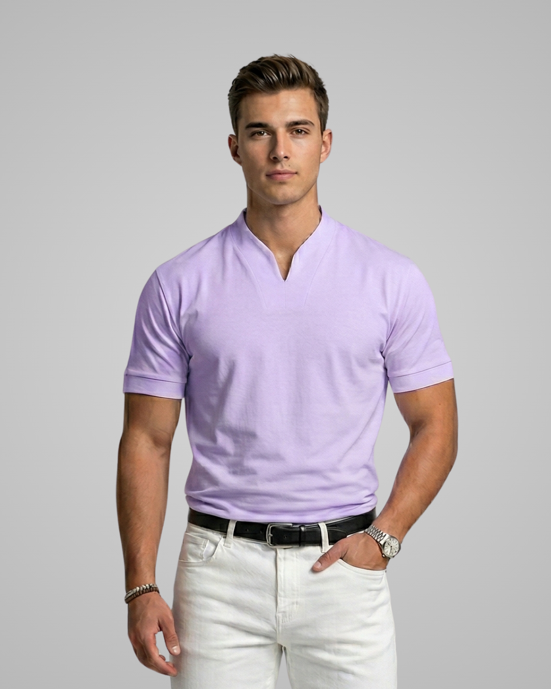 Man wearing a lilac polo shirt and white pants on a gray background
