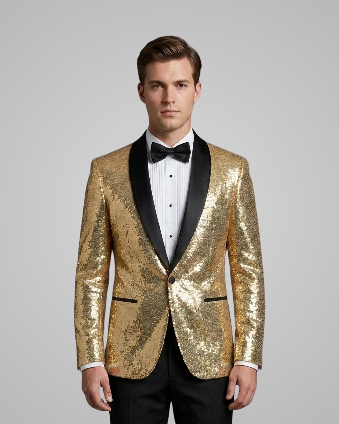 Man wearing a gold sequin tuxedo jacket with black lapels on a gray background