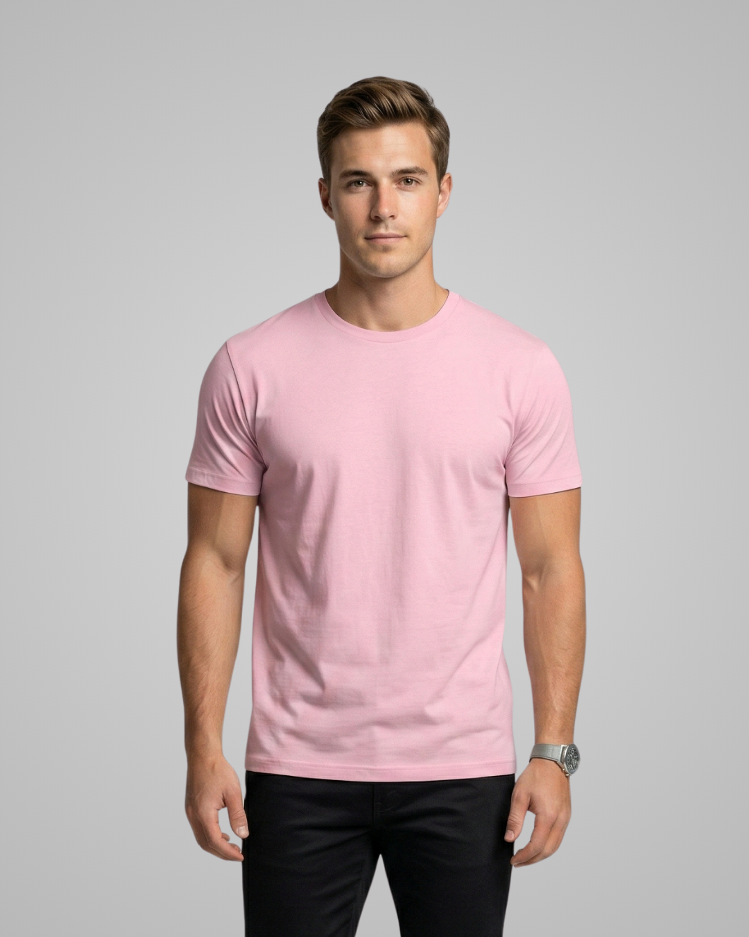 Man wearing a pink t-shirt against a gray background