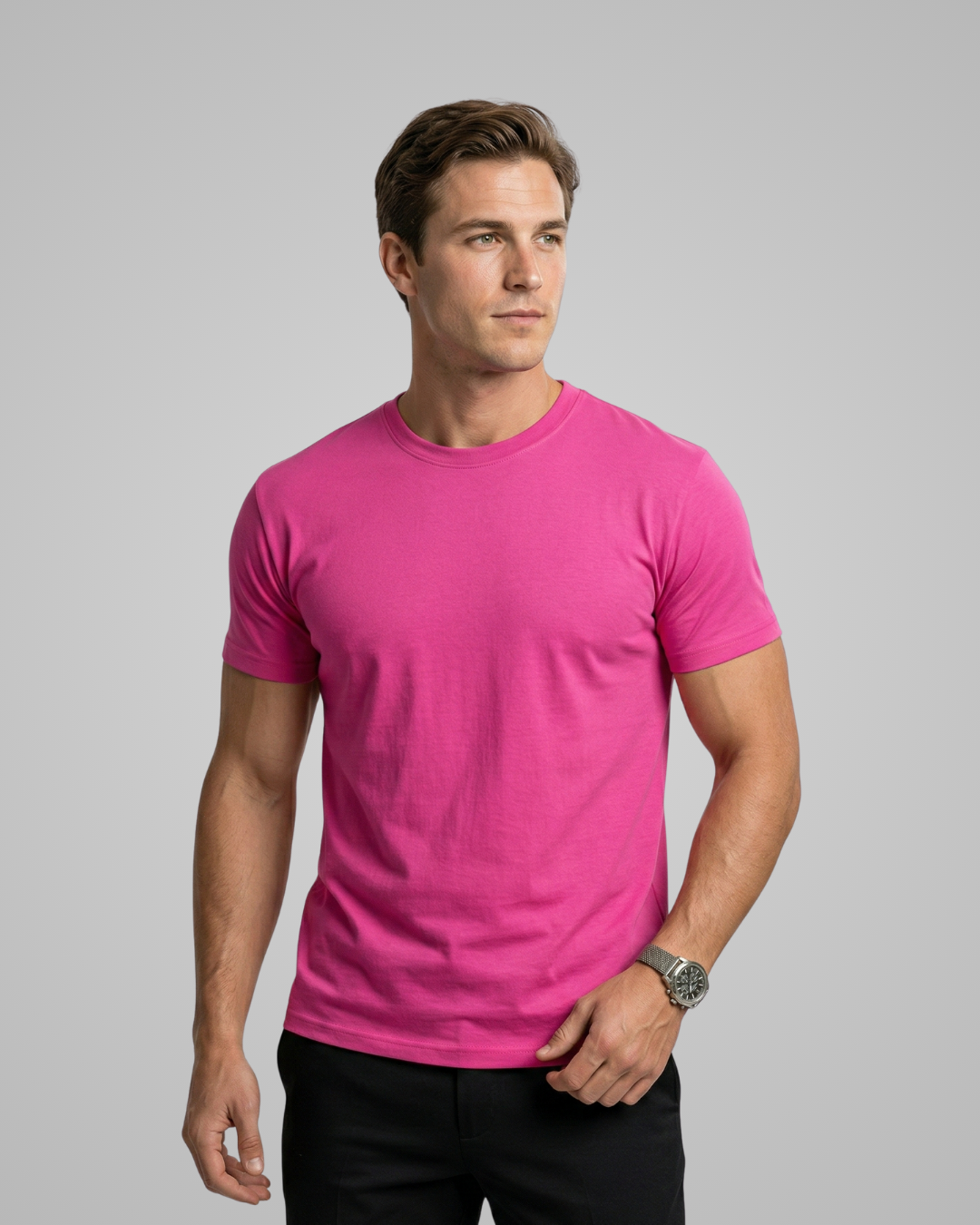 Man wearing a pink t-shirt against a gray background