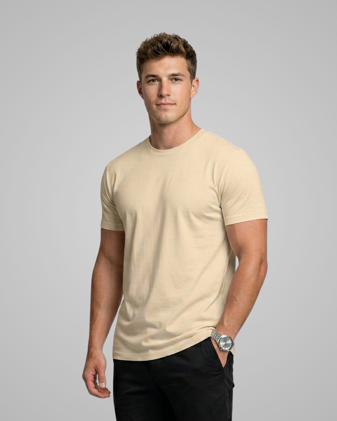 Man wearing a yellow t-shirt against a gray background