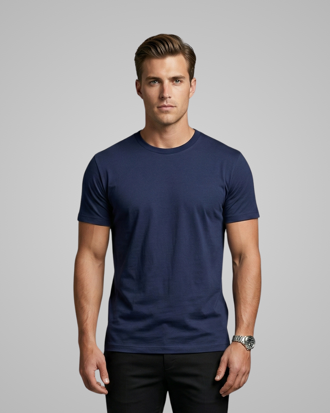 Man wearing a navy blue t-shirt against a gray background