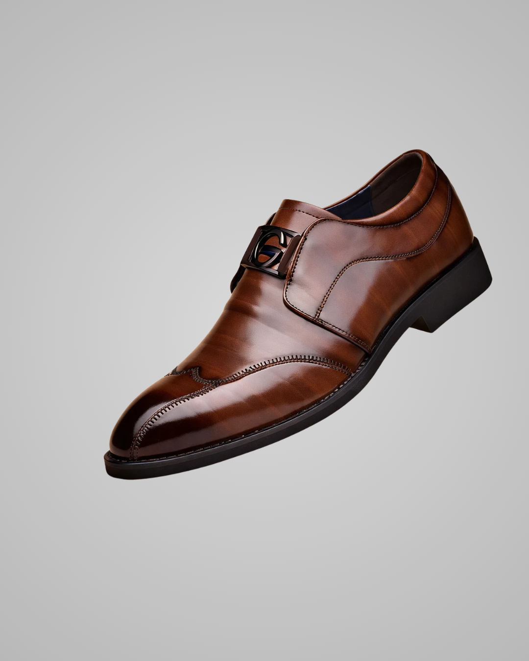 Brown leather dress shoe on a gray background