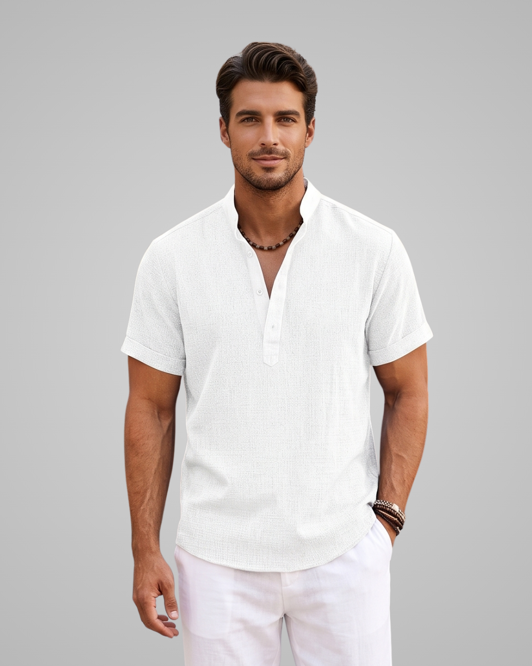 Man wearing a white short-sleeve shirt and pants on a gray background