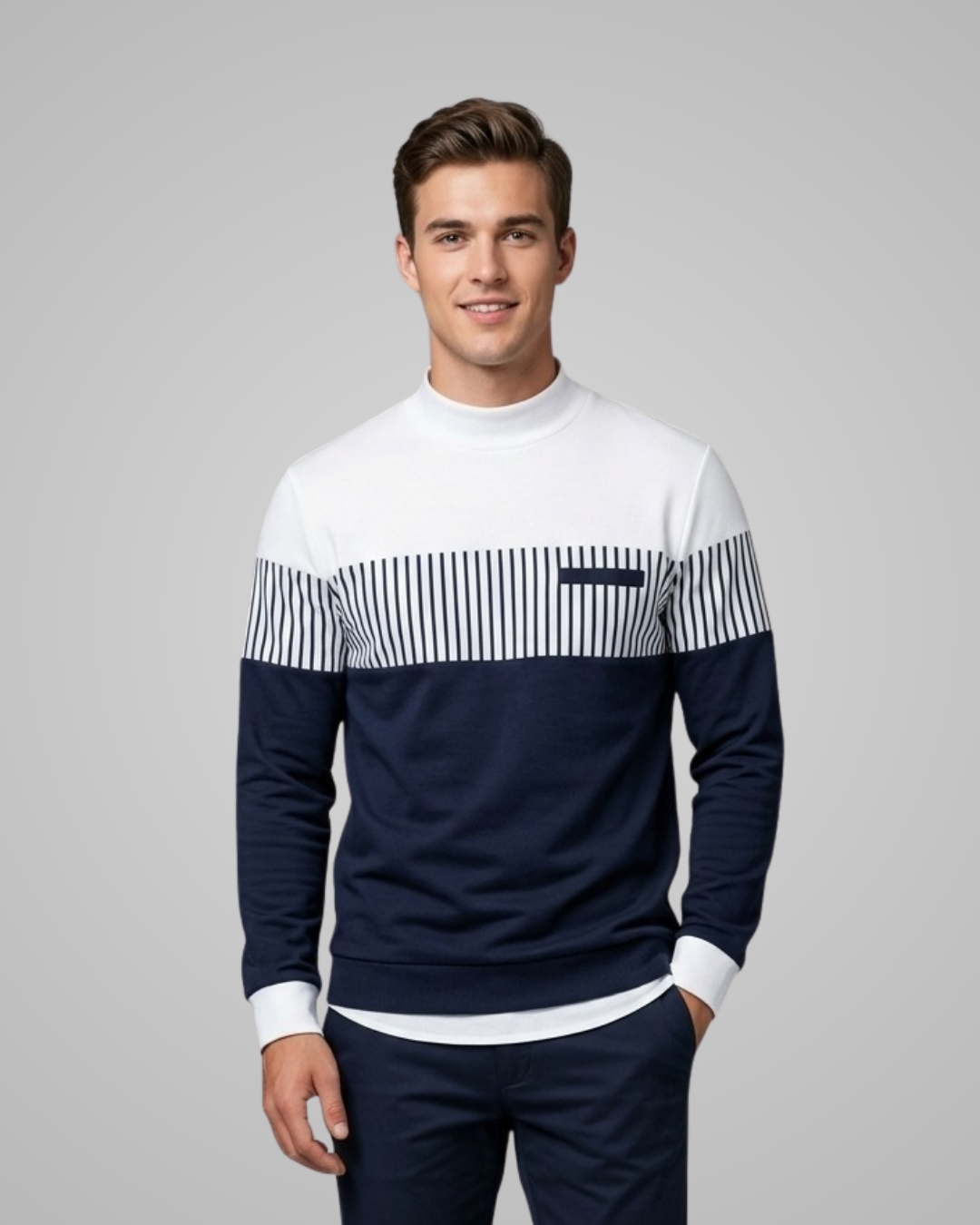 Man wearing a navy and white striped sweater on a gray background