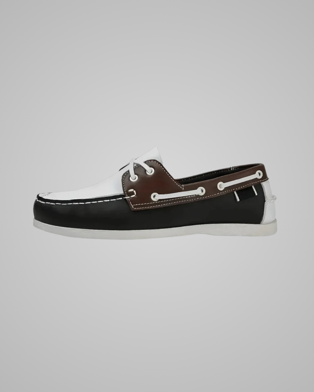 Brown leather boat shoe on a white background