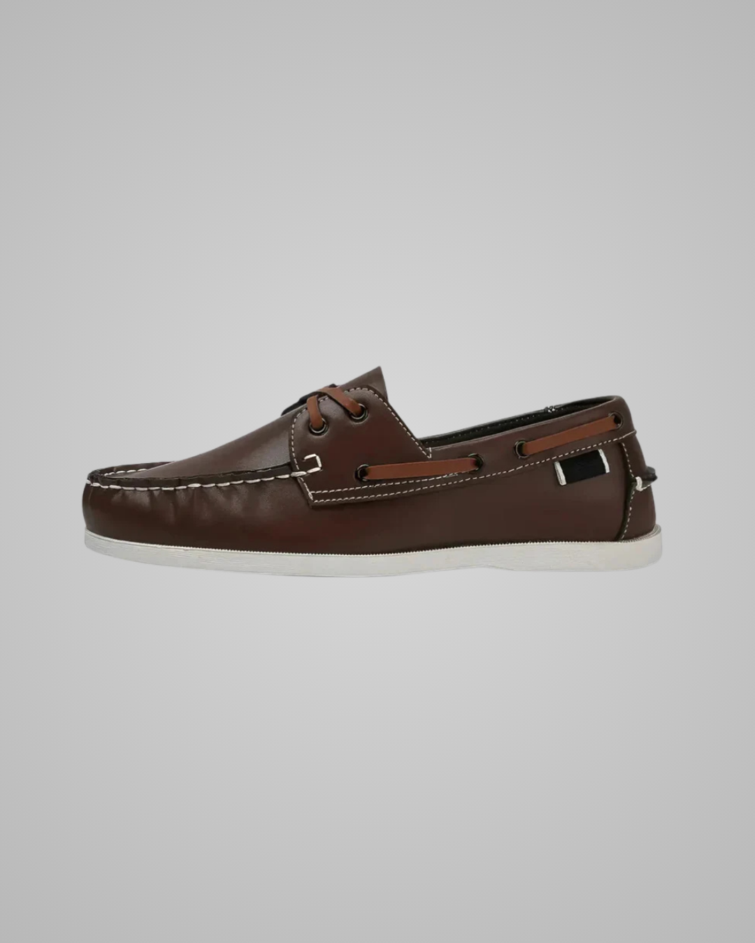Brown sandal with a single strap on a white background