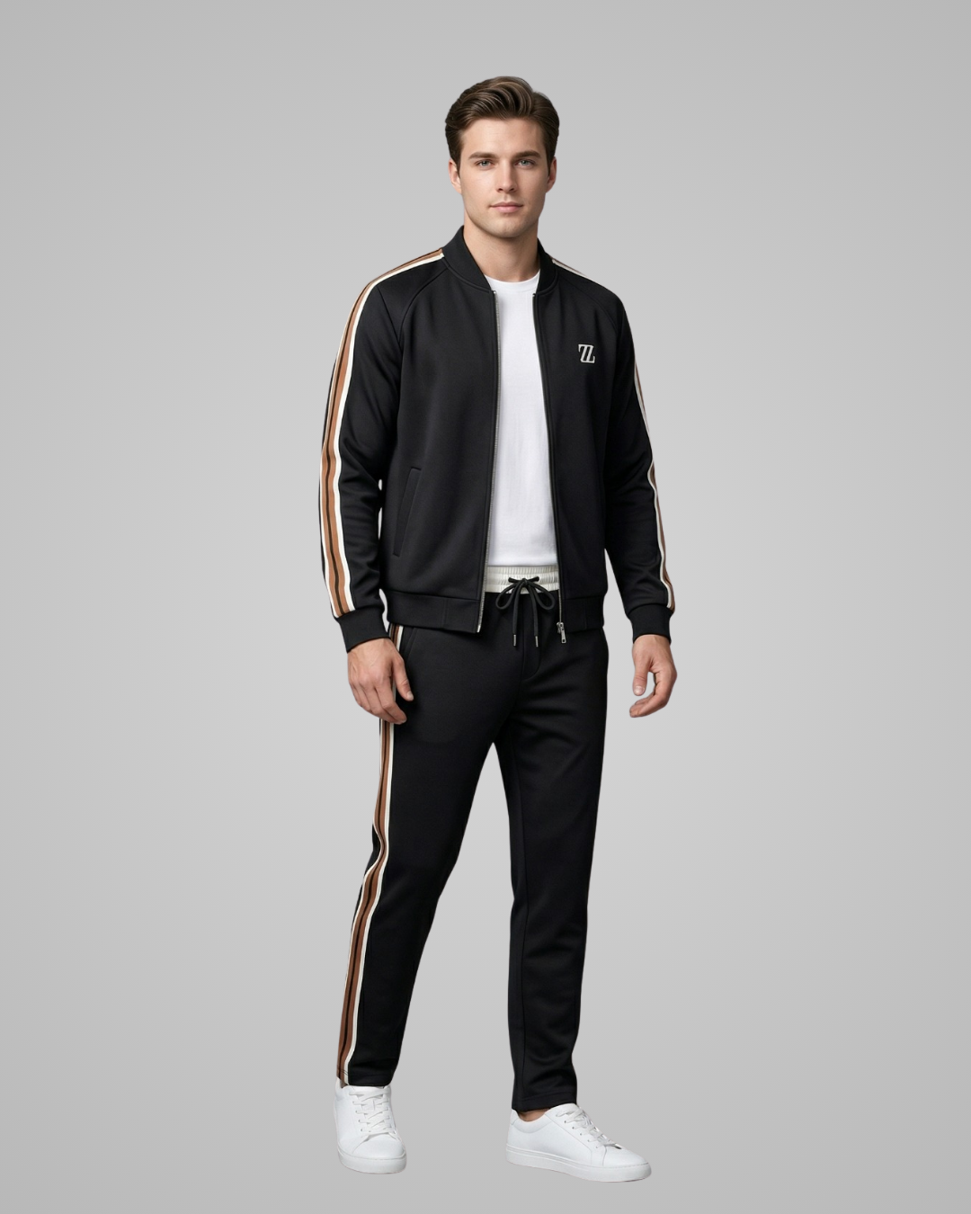 Man wearing a black tracksuit with white stripes on a gray background