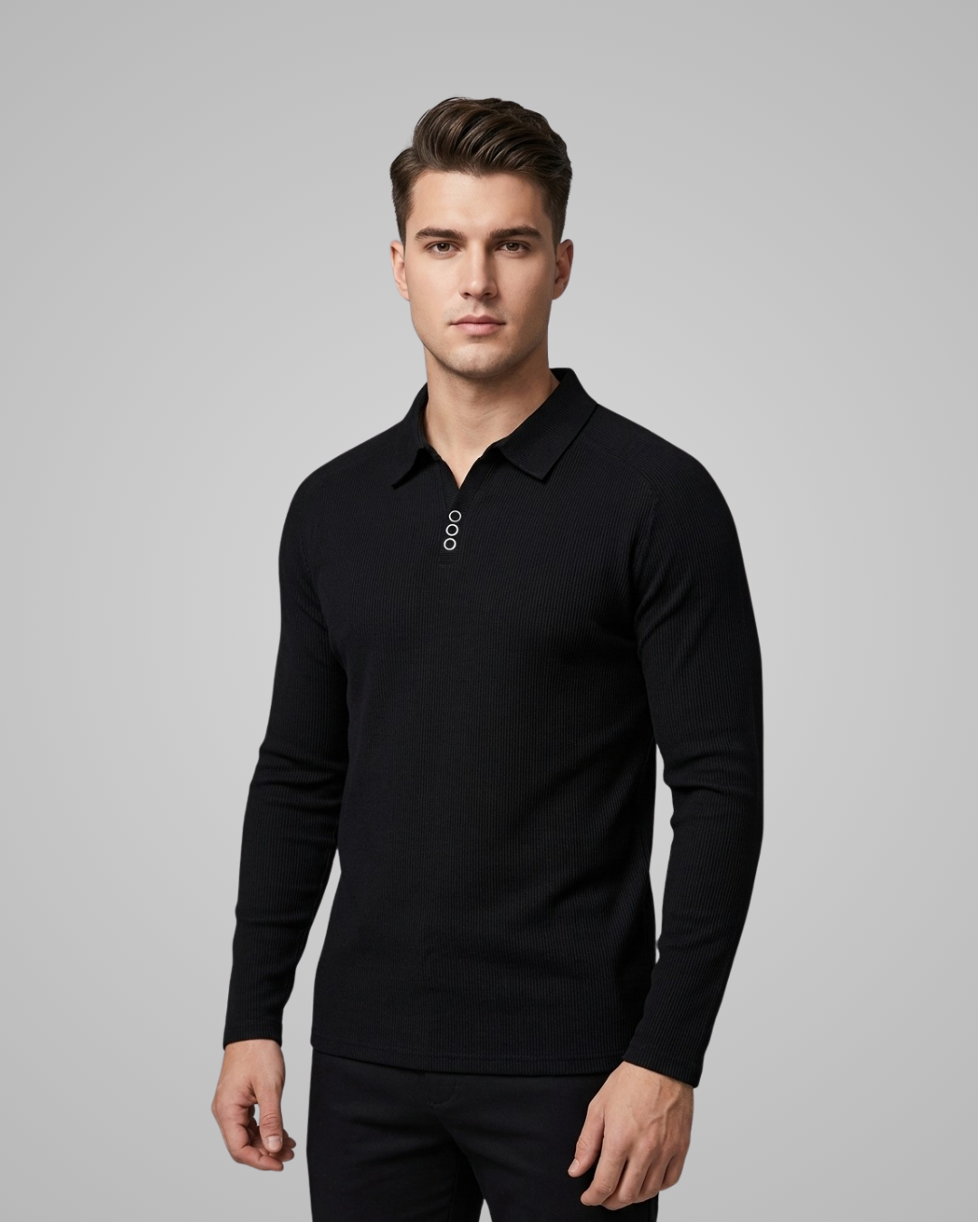 Man wearing a black long-sleeve polo shirt against a gray background