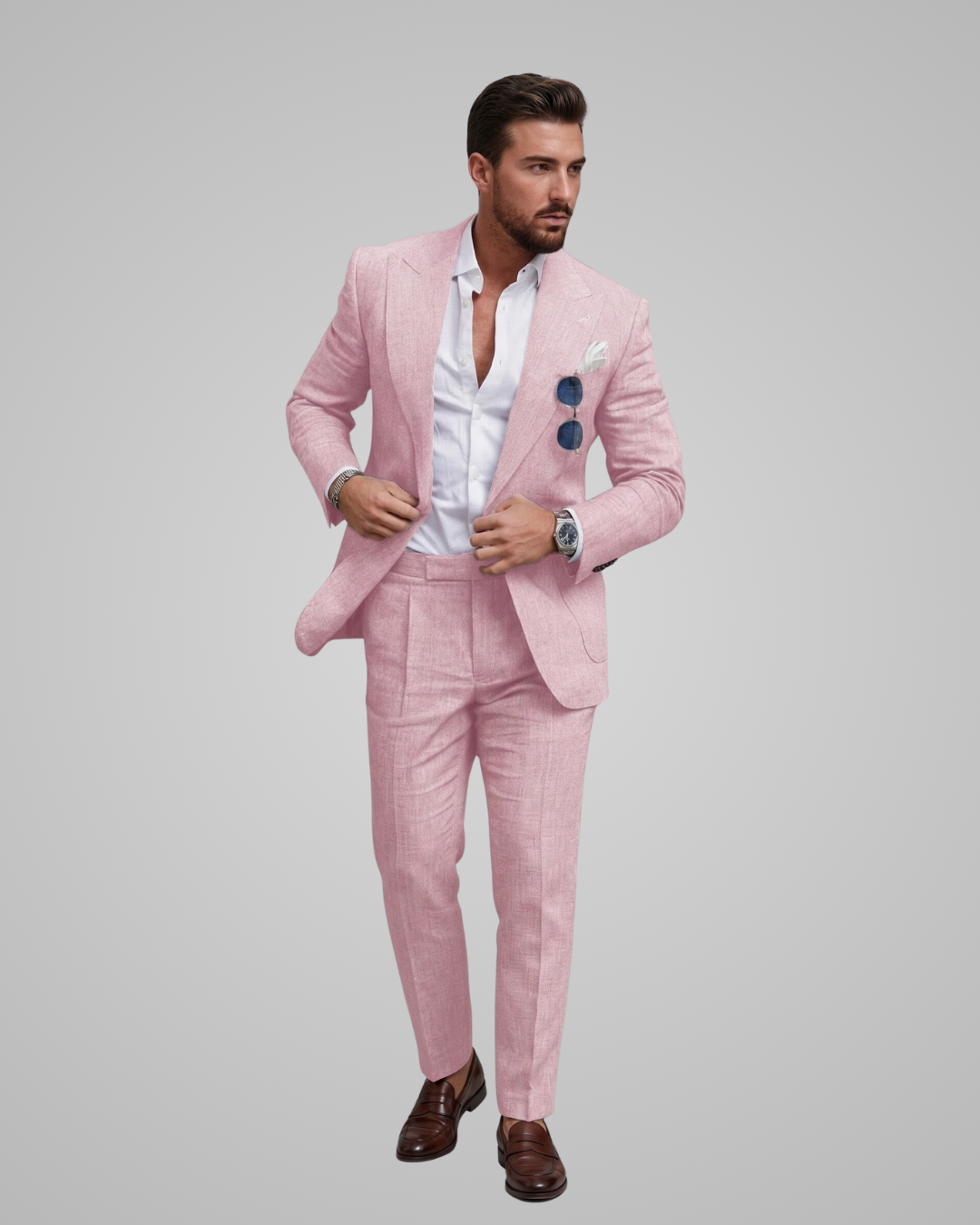 Man wearing a pink suit with a white shirt on a gray background