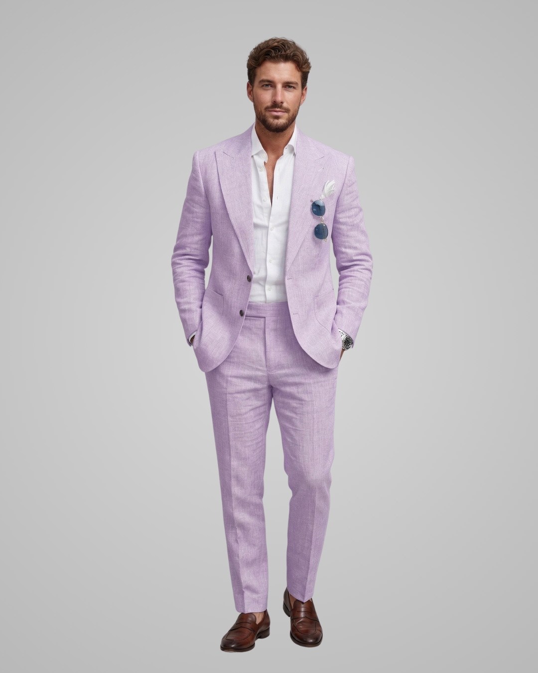 Man wearing a light purple suit with a white shirt on a gray background