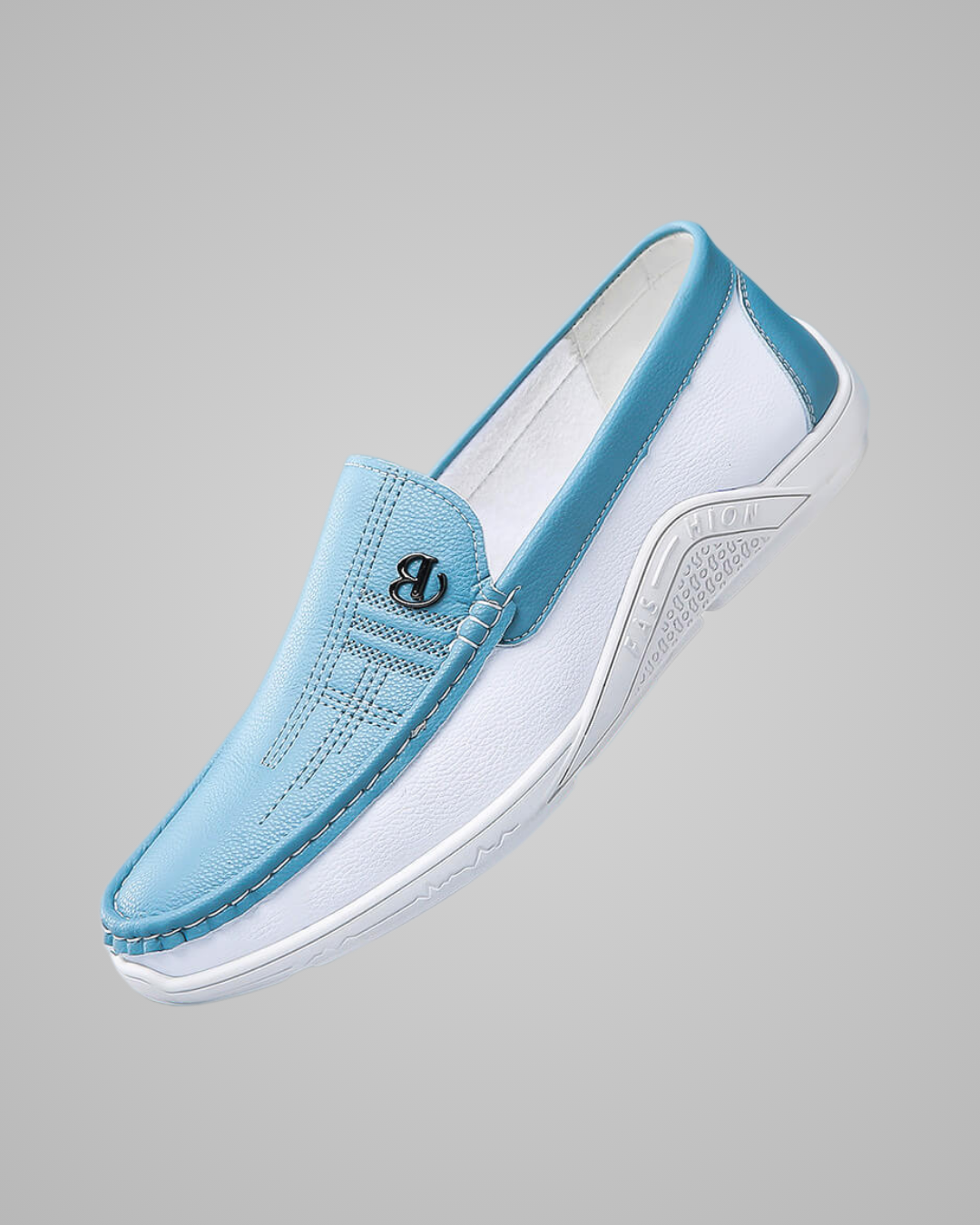A light blue and white slip-on wedge sneaker with a textured leather upper, a black interlocking logo on the side, and a white wedge sole, shown against a solid gray background.