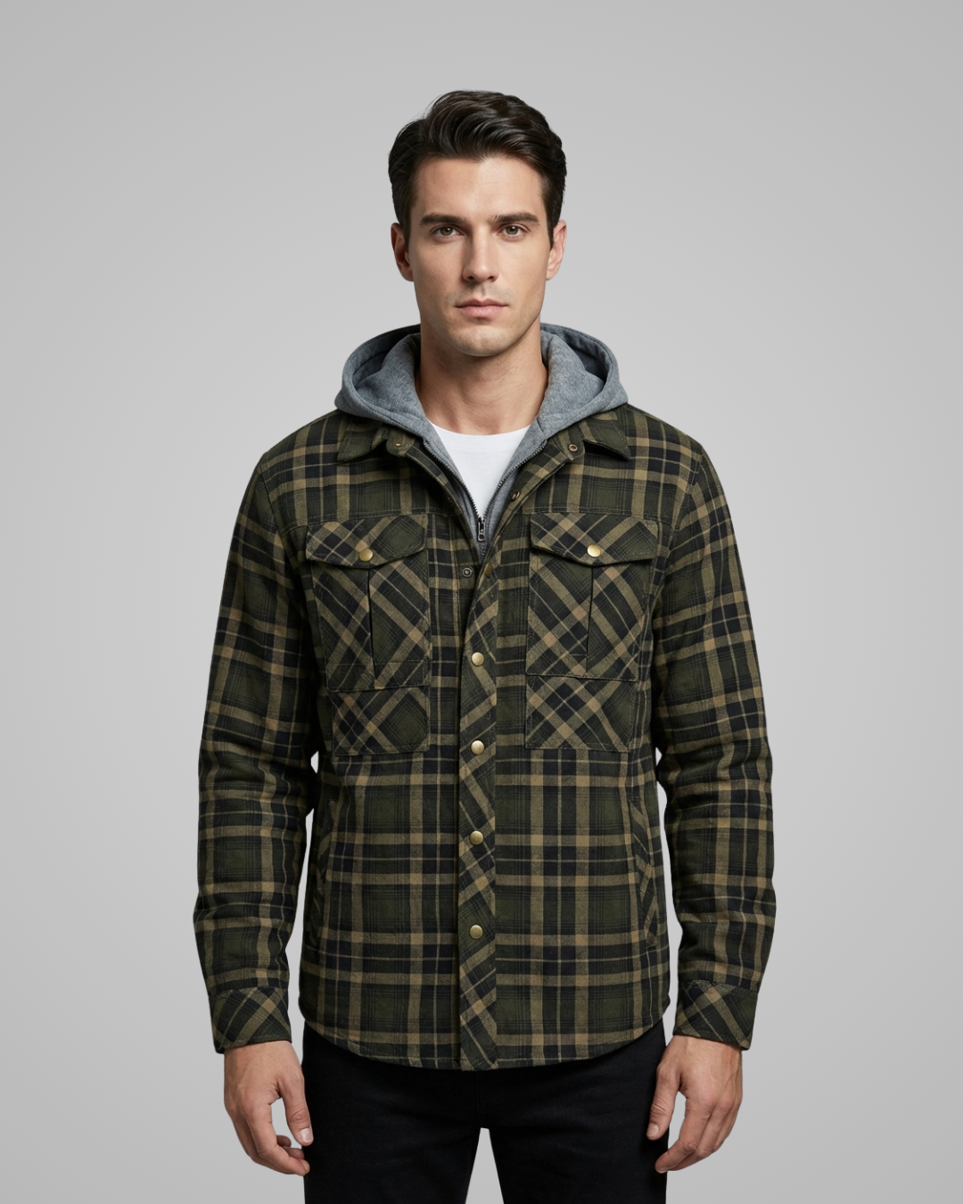 Man wearing a plaid jacket with a gray hood on a gray background