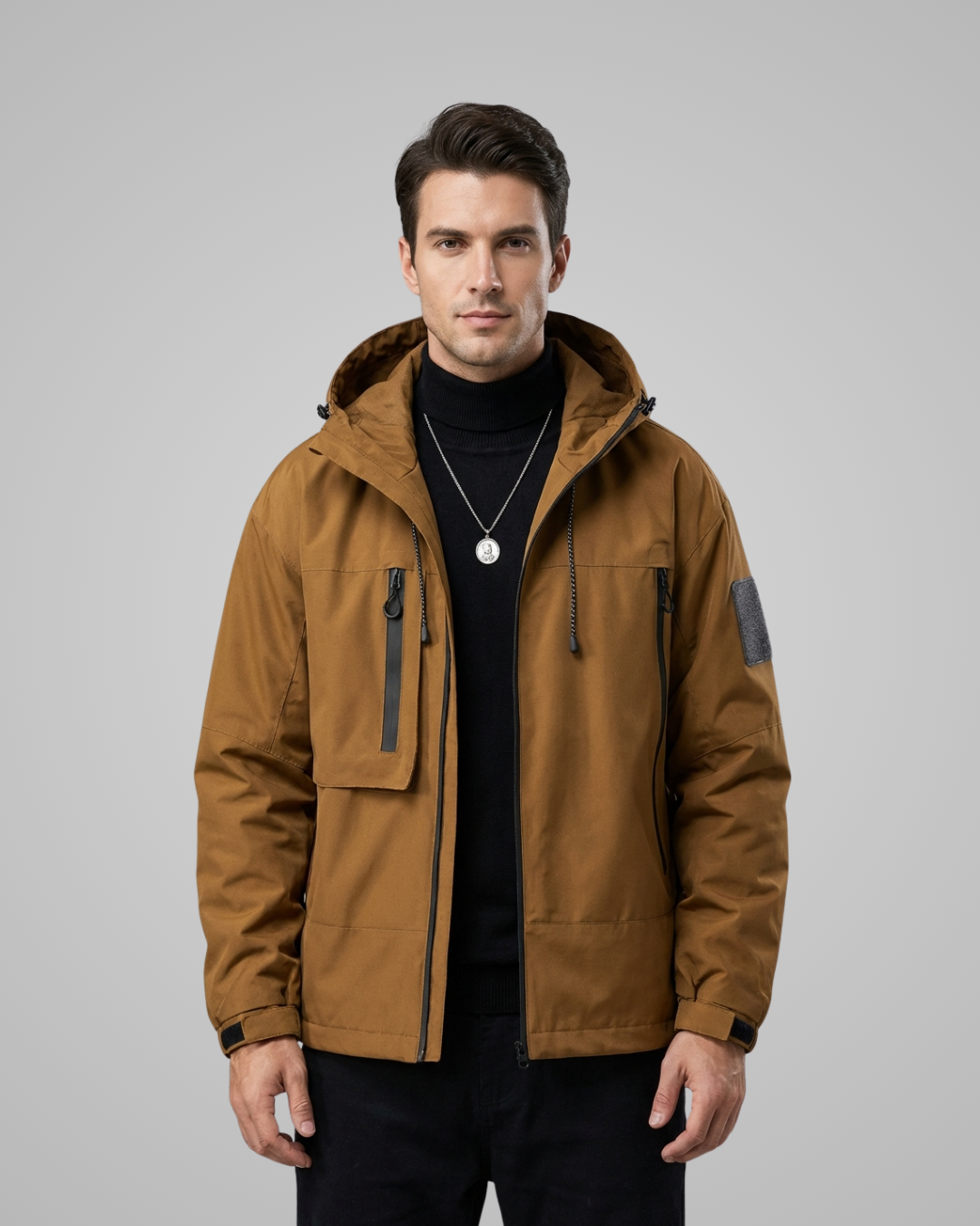 Man wearing a brown jacket on a gray background