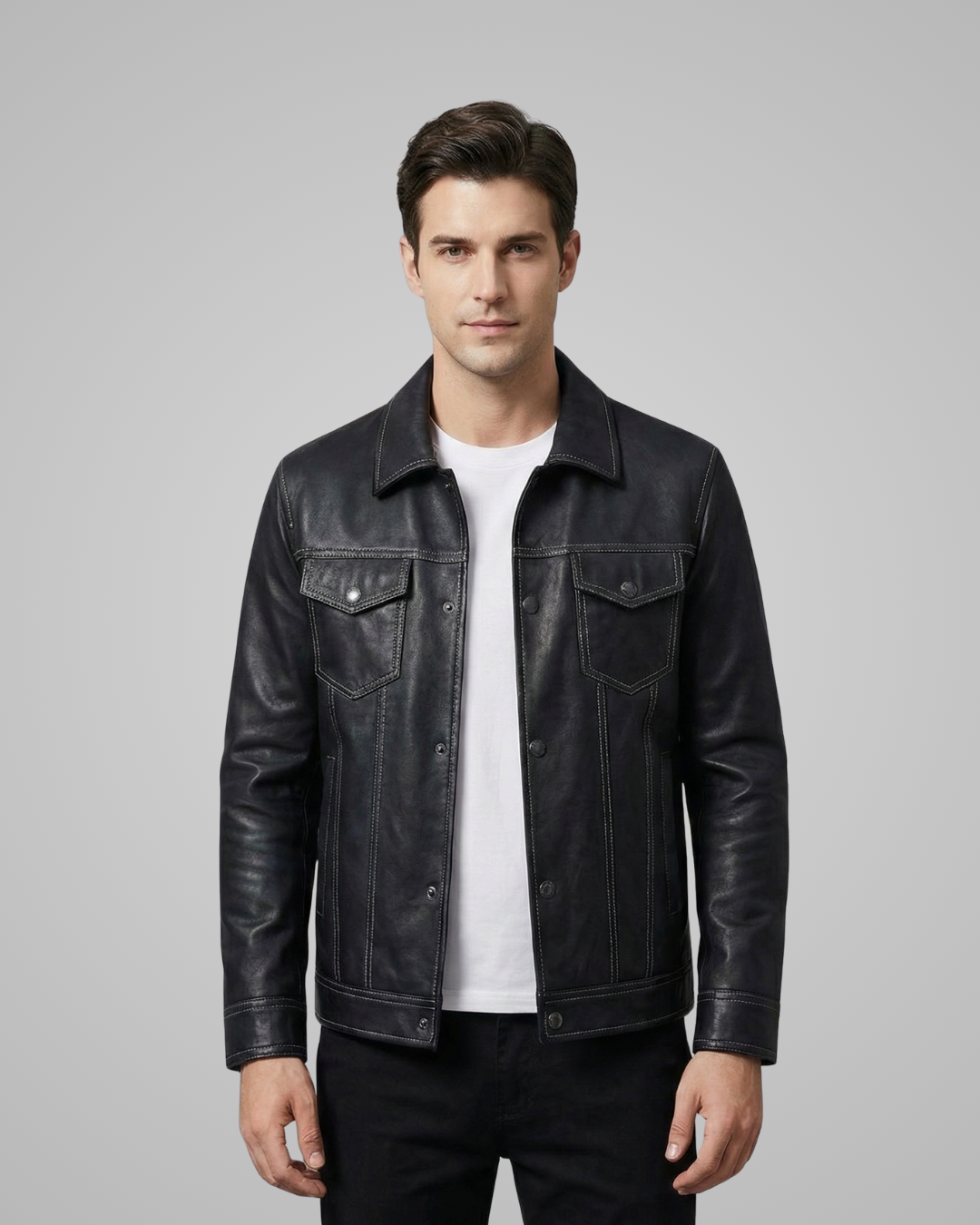 Man wearing a black leather jacket on a gray background
