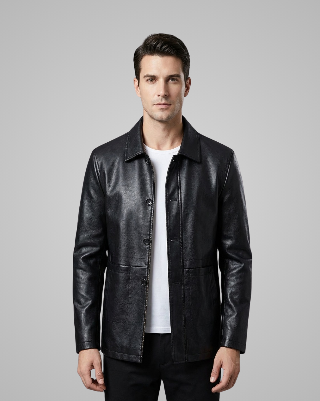 Man wearing a black leather jacket on a gray background