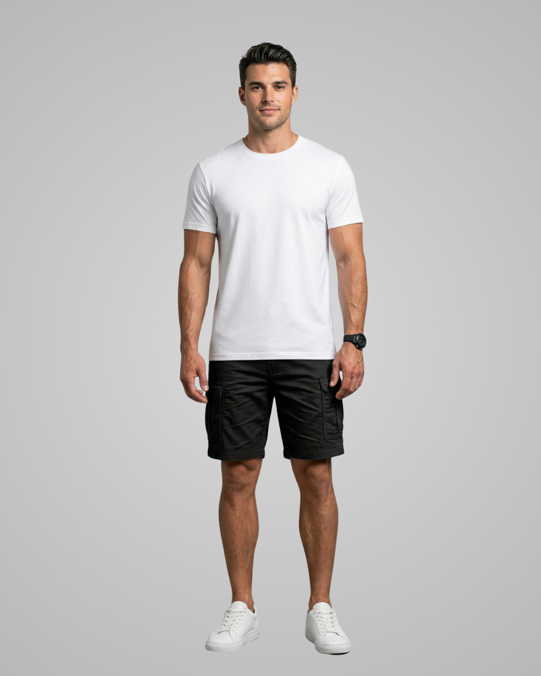Man wearing a white t-shirt and black shorts on a gray background