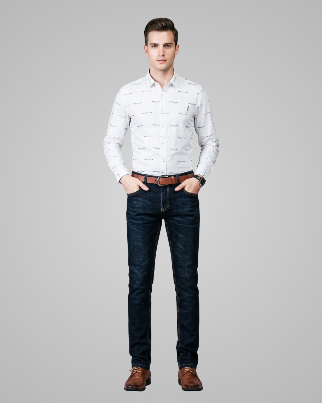 Man wearing a white patterned shirt and dark jeans on a gray background
