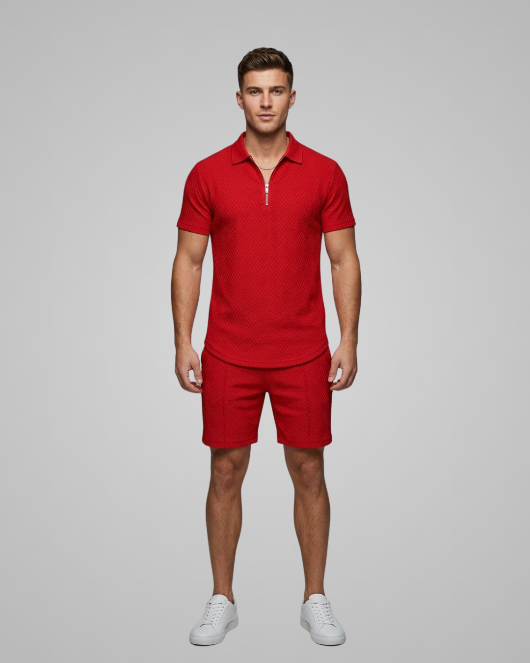 Man wearing a red polo shirt and shorts set on a gray background