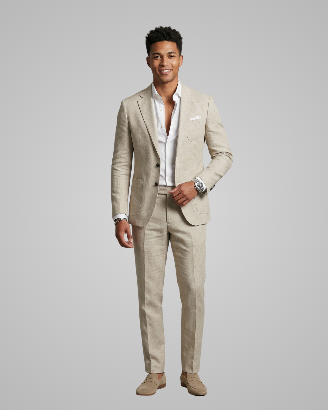 Man wearing a beige suit with a white shirt on a gray background
