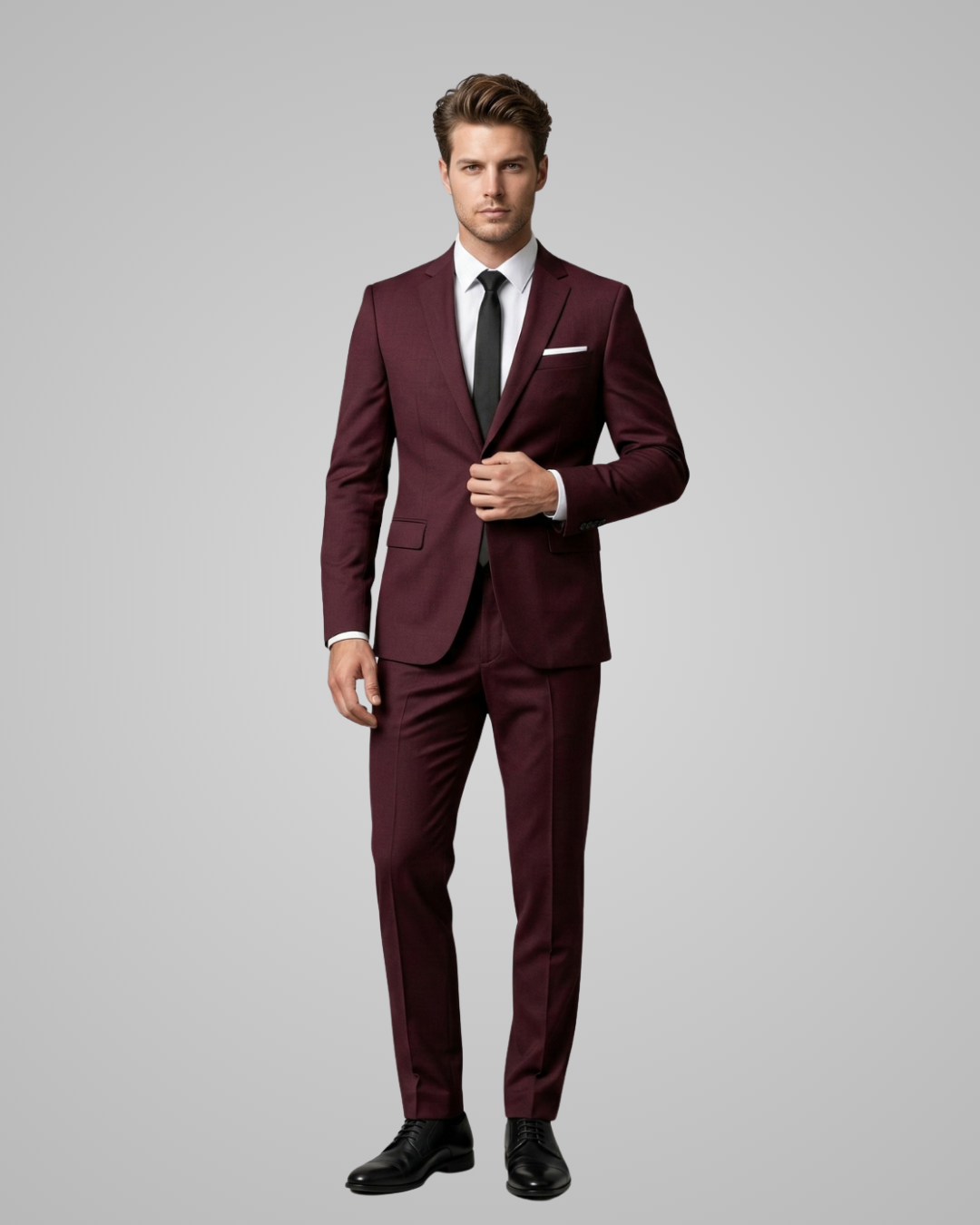 Man wearing a burgundy suit with a gray background