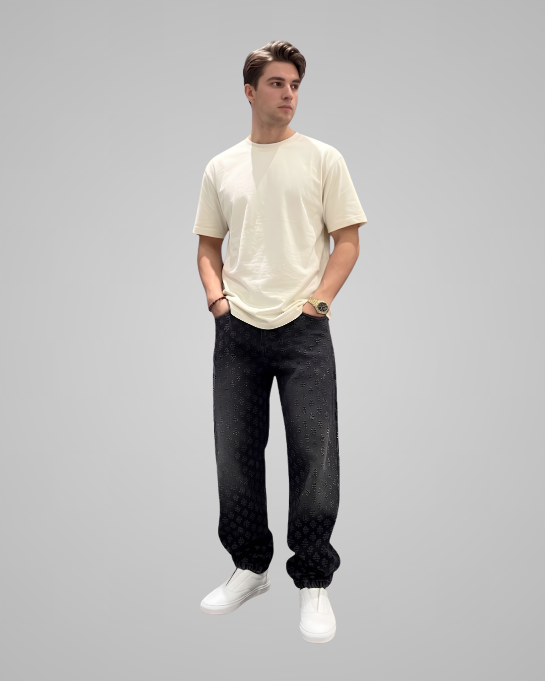 Person wearing a beige t-shirt and black pants on a gray background