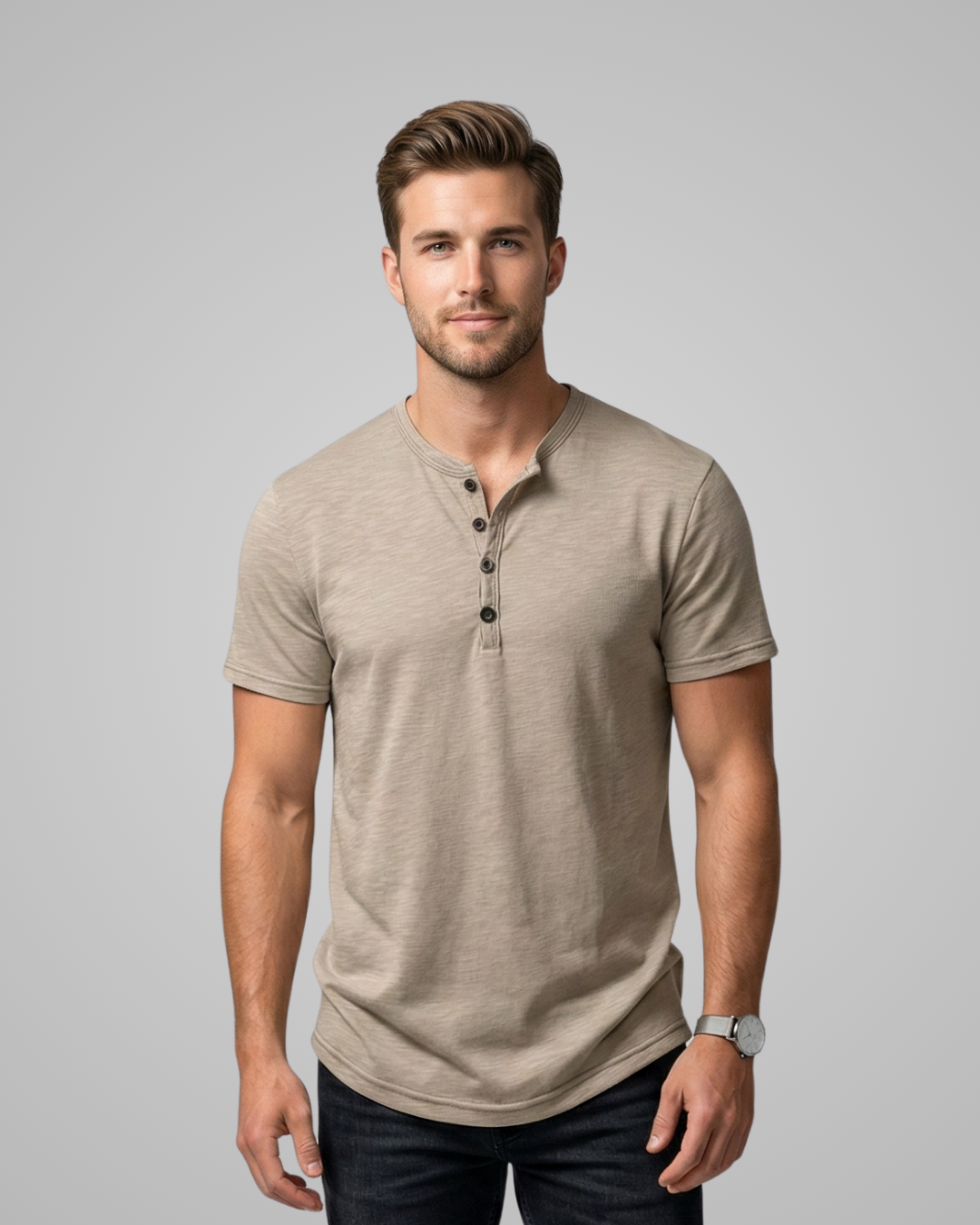 Man wearing a beige henley shirt against a gray background