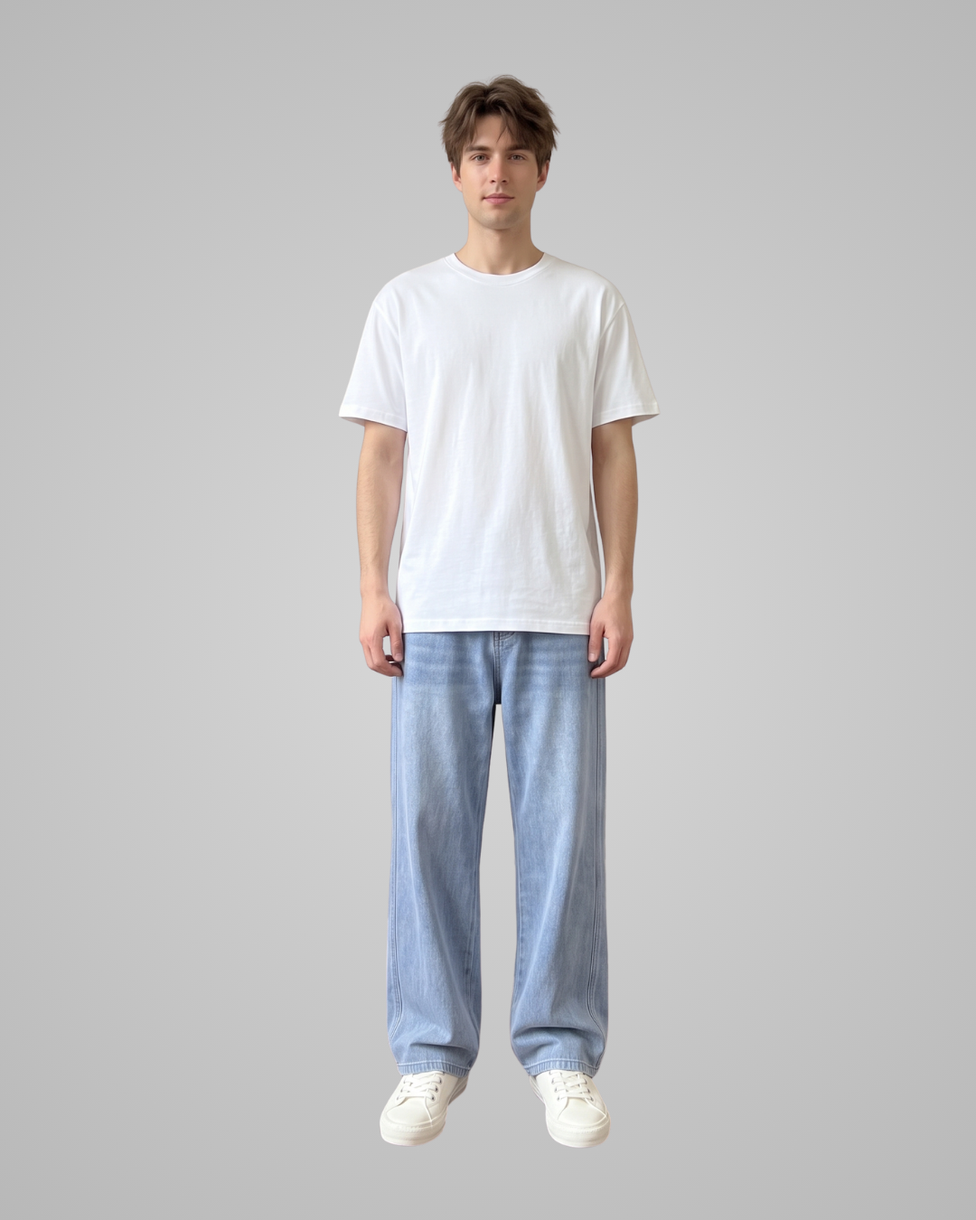 Person wearing a white t-shirt and light blue pants on a gray background