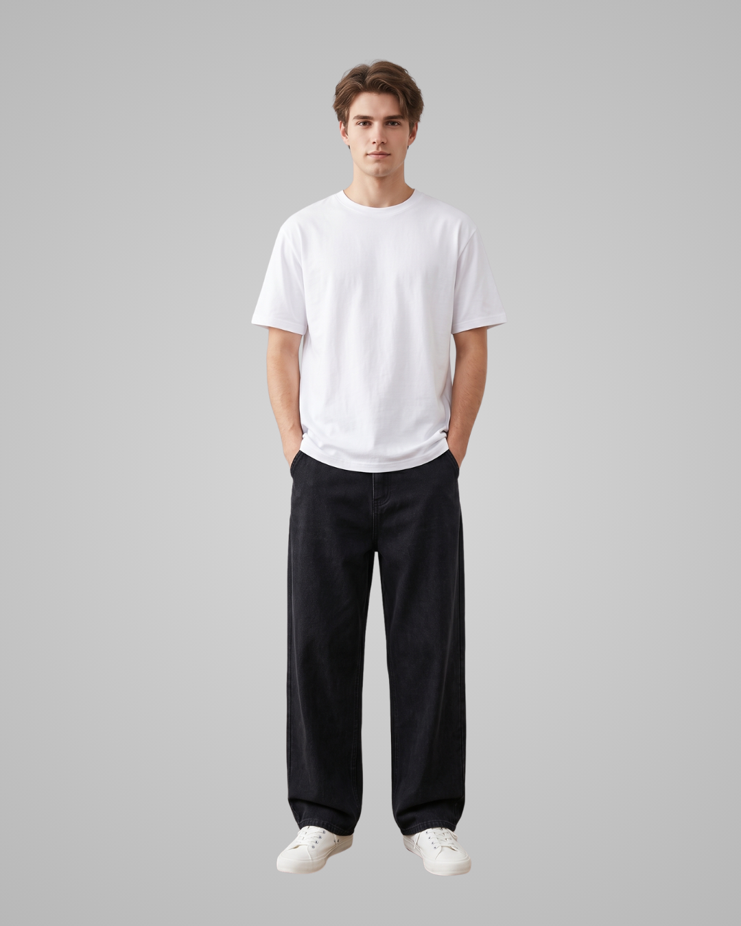 Person wearing a white t-shirt and black pants on a gray background