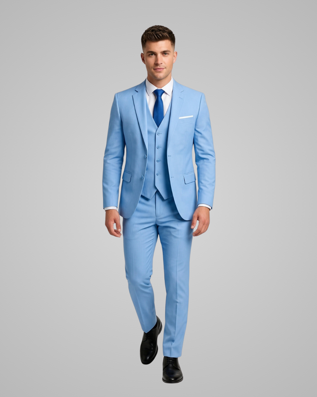 Man wearing a light blue suit with a gray background