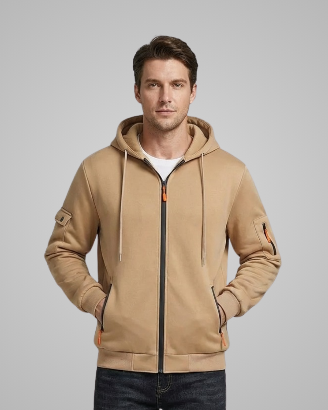 Man wearing a beige hoodie with a gray background
