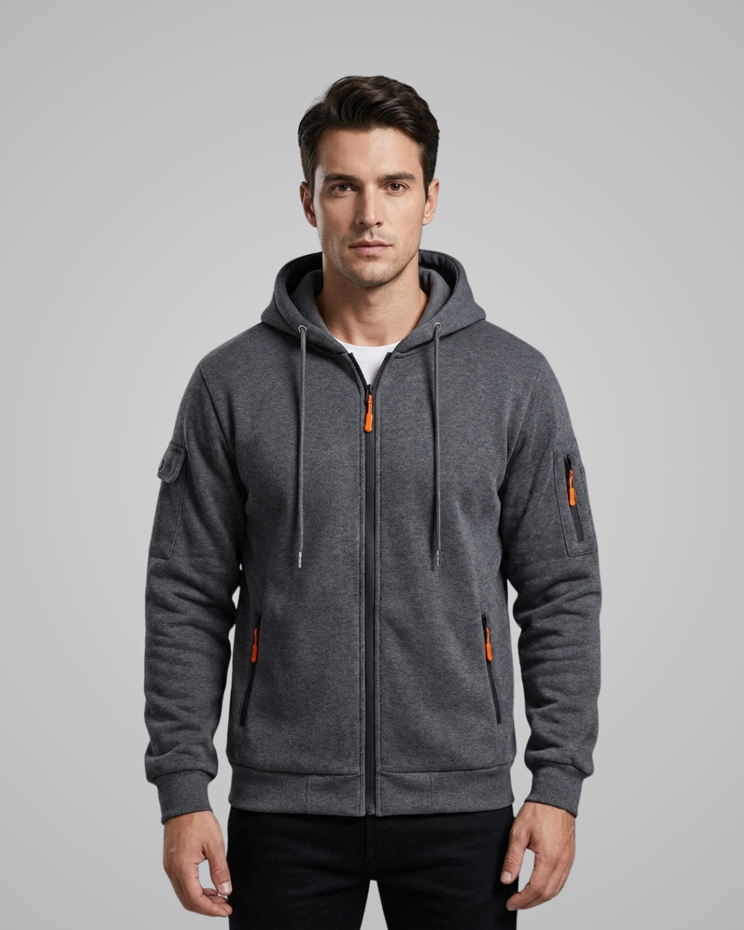 Man wearing a gray hoodie with orange accents on a gray background